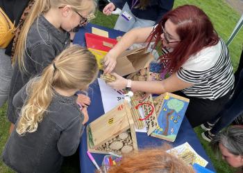 Children making Bee Hotels