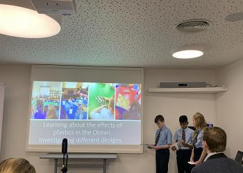 Pupils giving a presentation on the effects of plastic in the ocean. Schools taking part in the Zero Carbon Tour.