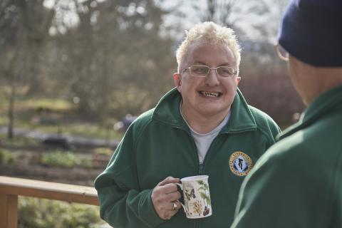 Ninewells Garden Wellbeing session, man holding mug